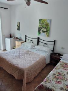 Postel nebo postele na pokoji v ubytování Agriturismo I Due Pini
