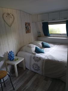 Postel nebo postele na pokoji v ubytování Tiny House plein centre
