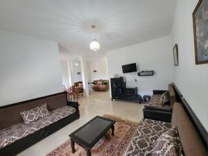 Posezení v ubytování Maison de vacance climatisée bien équipée
