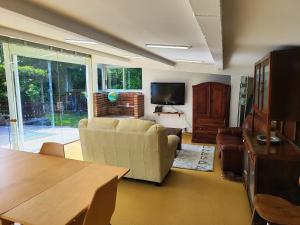 a living room with a couch and a table at A Casiña do Río in Neda