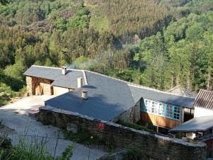 an aerial view of a house in the mountains at Sons do Eo- Apartamentos rurales sostenibles en Baleira Lugo in Baleira