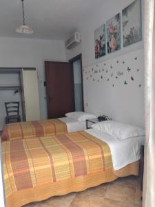 Postel nebo postele na pokoji v ubytování Agriturismo I Due Pini