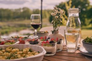 a table with plates of food and a glass of wine at Swobodna 6 in Swobodna +63 photos