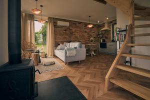 a living room with a couch and a fireplace at Swobodna 6 in Swobodna