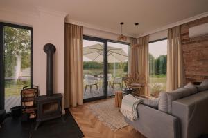 a living room with a couch and a fireplace at Swobodna 6 in Swobodna +49 photos