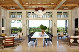 a dining room with a table and chairs at The Island House in Nassau