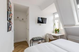 Μια τηλεόραση ή/και κέντρο ψυχαγωγίας στο B&B Achter de Kan