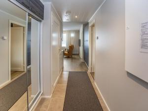 a hallway with a long hallway leading to a room at Holiday Home Levistar vi as- 6106 by Interhome in Levi