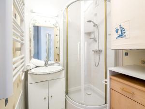 a bathroom with a shower and a sink at Apartment Cap Océan-8 by Interhome in Mimizan
