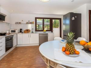 a kitchen with a table with a pineapple on it at Holiday Home Villa Bellevue by Interhome in Peñíscola
