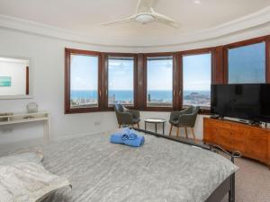 a bedroom with a bed and a flat screen tv at Holiday Home Villa Bellevue by Interhome in Peñíscola