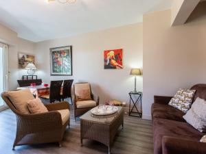 a living room with two couches and a table at Apartment Marines 2 by Interhome in Soorts-Hossegor