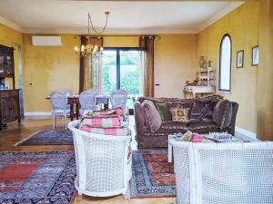 a living room with a couch and a table at Holiday Home Zuccheri Canditi by Interhome in Brucoli