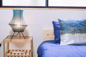 Postel nebo postele na pokoji v ubytování Tsubaki椿