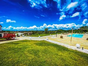 an image of a yard with a swimming pool at Villa Il Sogno Di Pietro by Interhome in Fondaccio