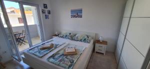 Ένα ή περισσότερα κρεβάτια σε δωμάτιο στο Apartman Belisima Deluxe