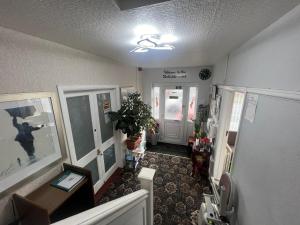 a room with a hallway with doors and a hallway at The Northdale Hotel Ltd in Skegness