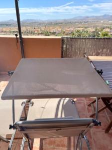 a ping pong table on top of a balcony at Attic La Mirada - Bonalba Golf in Mutxamel