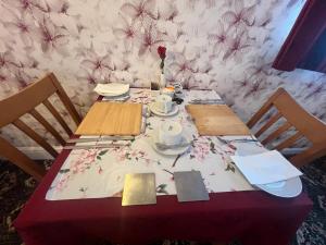 a table with a table cloth on top of it at The Northdale Hotel Ltd in Skegness