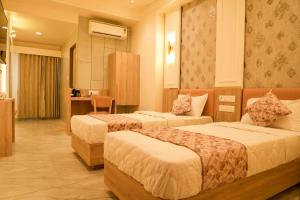 Postel nebo postele na pokoji v ubytování Hotel El Lujo