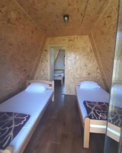 Postelja oz. postelje v sobi nastanitve Katun Mokra accommodation & horseback riding