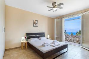 Postel nebo postele na pokoji v ubytování Scorpina Villas