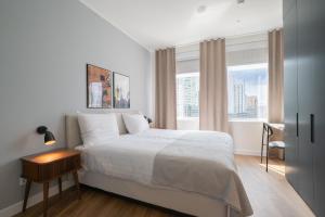 a bedroom with a white bed and a window at Limehome Amsterdam Gatwickstraat in Amsterdam +42 photos