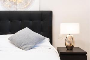 Postel nebo postele na pokoji v ubytování Pino Golf Garden Apartment Elviria