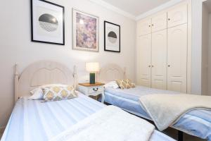 Postel nebo postele na pokoji v ubytování Pino Golf Garden Apartment Elviria