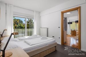 Posteľ alebo postele v izbe v ubytovaní Apartments Rona Erea Icici + 37 fotografií