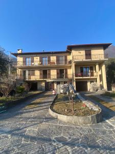 a building with a tree in front of it at Cà Maria Maurela in Ossuccio