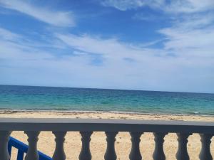 a view of the beach from a balcony at Résidence lalla baya appart 1 in Sousse +4 photos