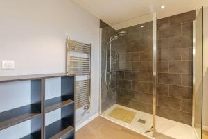 a bathroom with a shower with a glass door at Les Vespres - Farm House Near Bernex and Thollon les Memises in Saint-Paul-en-Chablais +21 photos