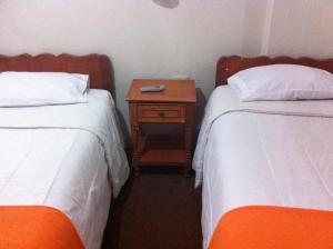 Voodi või voodid majutusasutuse Hostal Tu Hogar toas