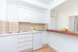A kitchen or kitchenette at Apartamentos Massanet