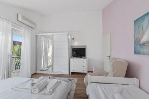 Postel nebo postele na pokoji v ubytování Apartments Petrina