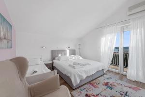 Postel nebo postele na pokoji v ubytování Apartments Petrina