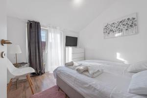 Postel nebo postele na pokoji v ubytování Apartments Petrina