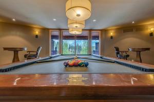 a large billiard table in a room with at Luxury Canmore Vacations in Canmore