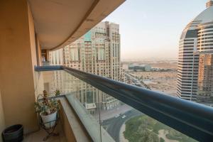 a balcony in a building with a view of a city at Ideal for Families Close to ALL Amenities in Dubai