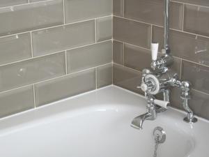 a sink in a bathroom with a faucet at The One Tun Pub & Rooms in London