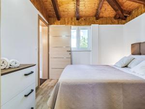 a bedroom with a bed and a window at Holiday Home Villa Frane by Interhome in Maslenica +84 photos