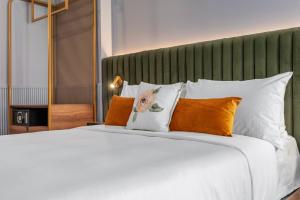Postel nebo postele na pokoji v ubytování Hôtel Maurice
