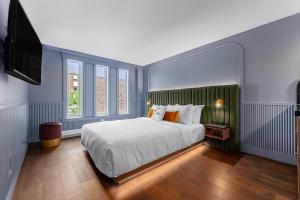 Postel nebo postele na pokoji v ubytování Hôtel Maurice