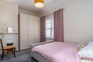 a bedroom with a bed and a chair at The Chancery in Dublin