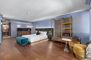 Postel nebo postele na pokoji v ubytování Hôtel Maurice