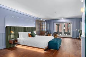 Postel nebo postele na pokoji v ubytování Hôtel Maurice