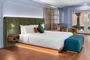 Postel nebo postele na pokoji v ubytování Hôtel Maurice