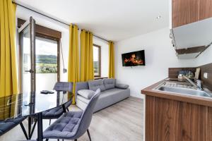 Kuchyň nebo kuchyňský kout v ubytování VonMos Moselblick Apartments