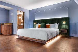 Postel nebo postele na pokoji v ubytování Hôtel Maurice